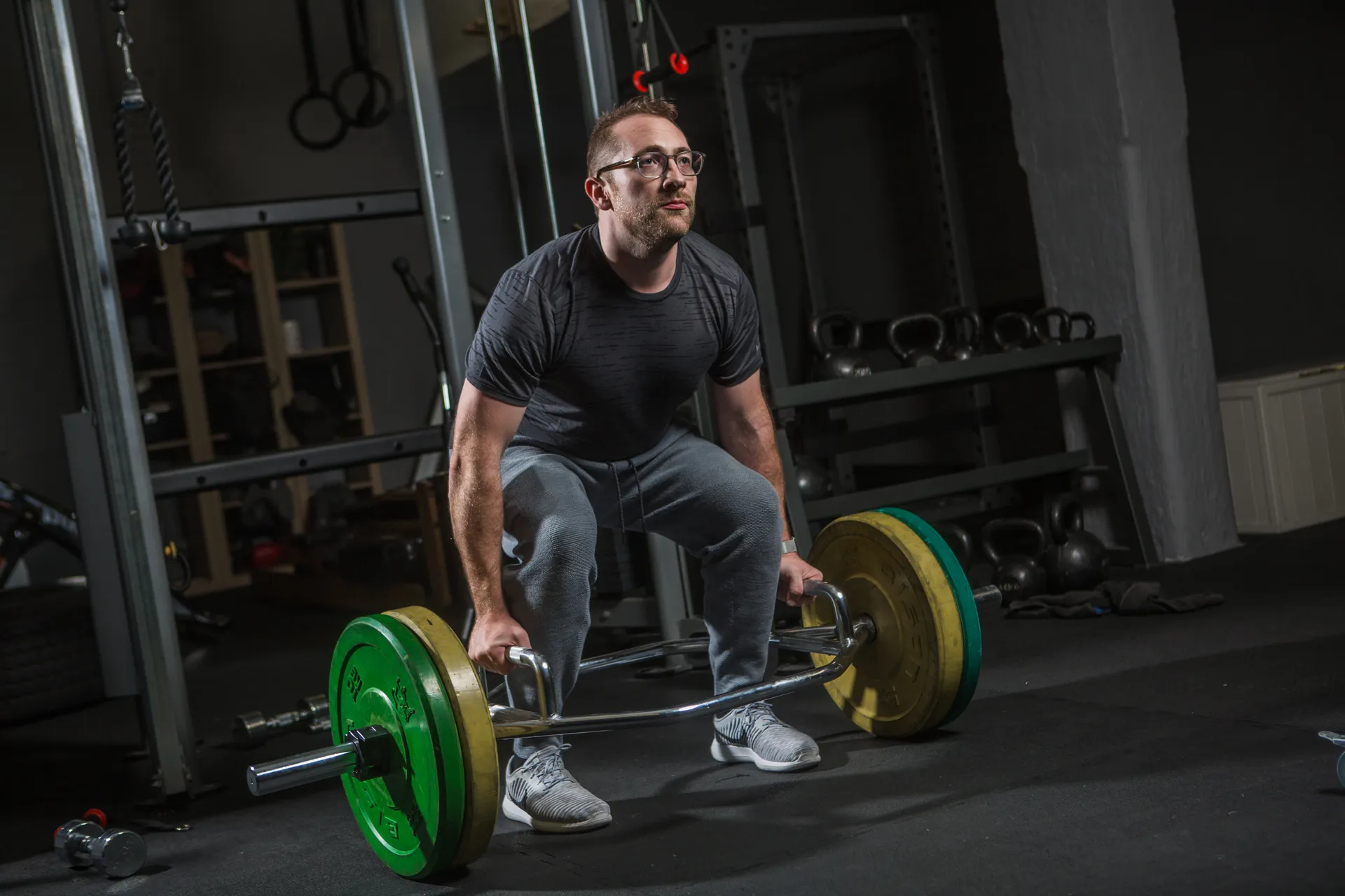 Evolve member performing a coached deadlift