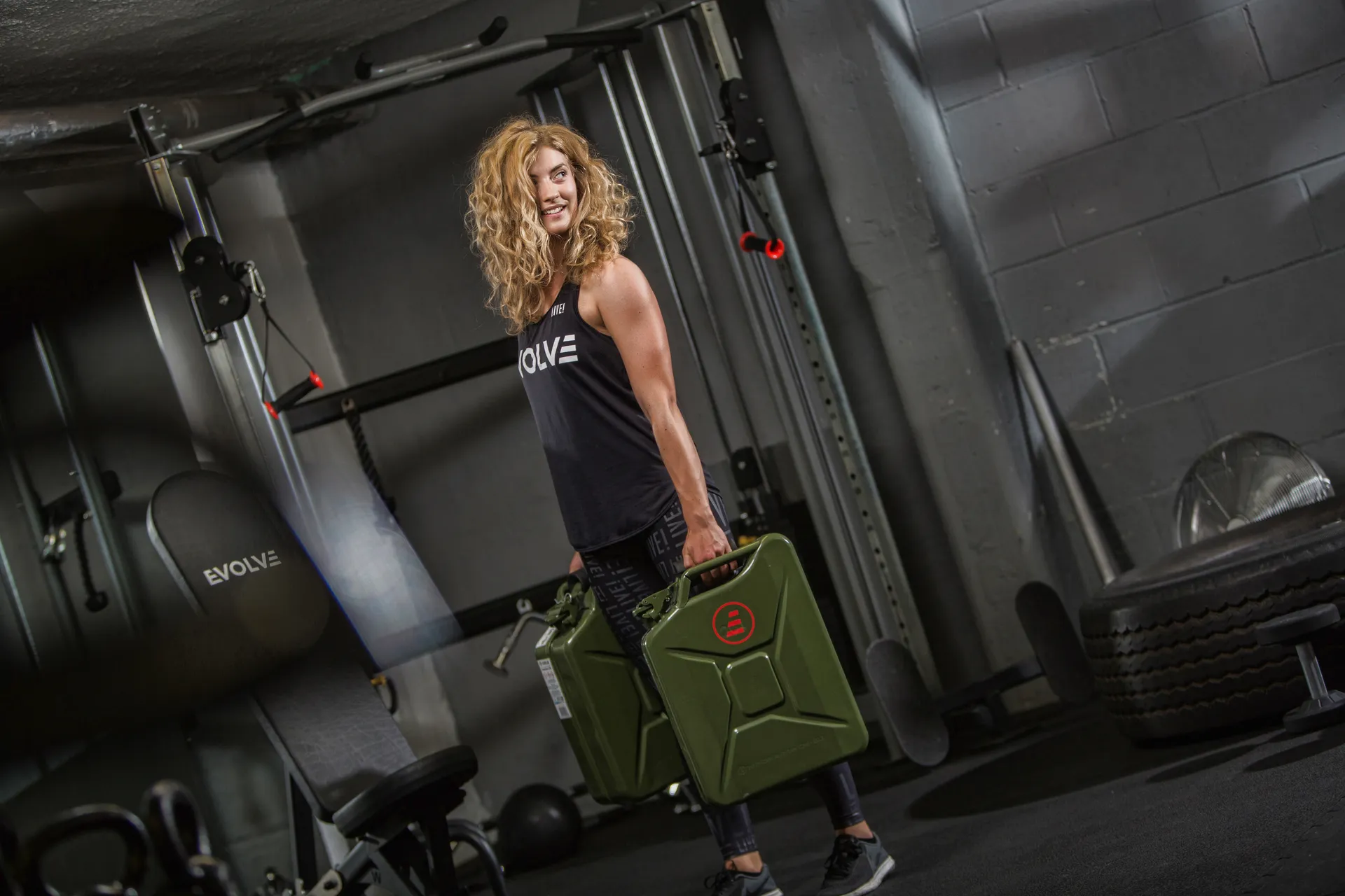 Evolve member carrying weights through a coached training session