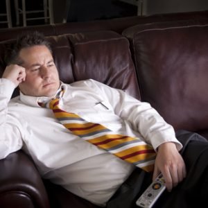 Lazy,Male,Watching,Television,At,Home